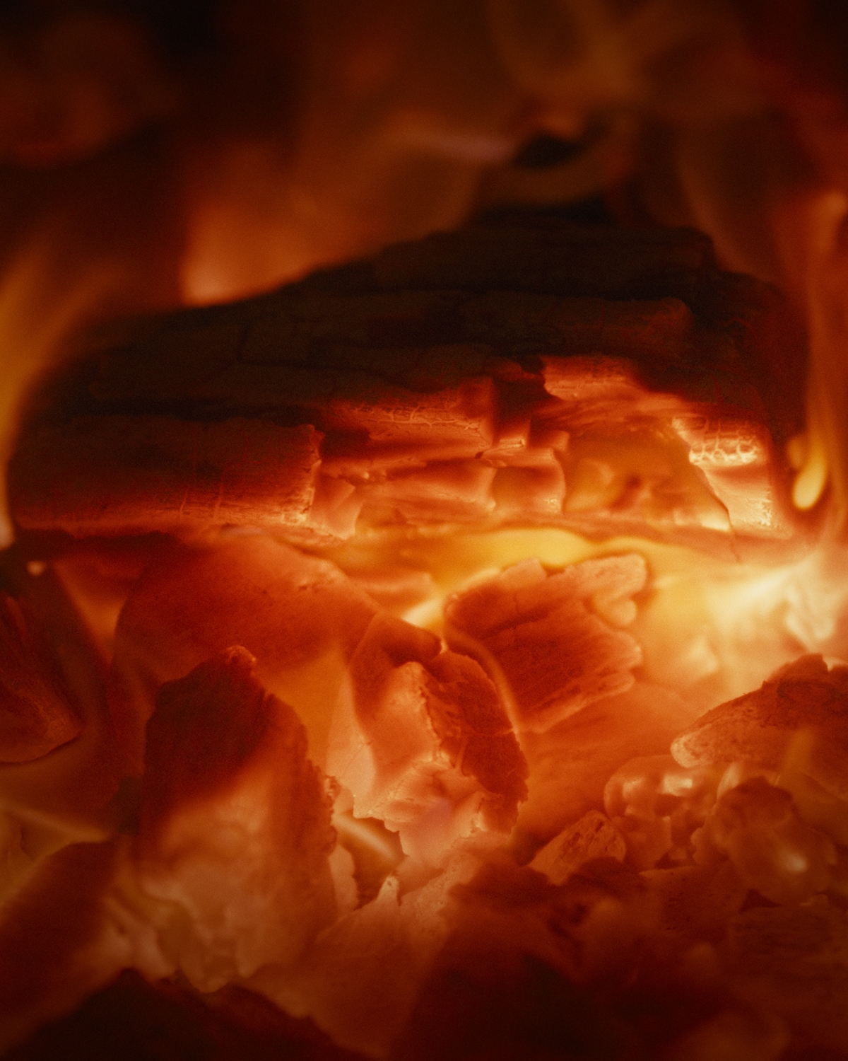 Embers within the Emberhaus Fire Oven glowing elegantly