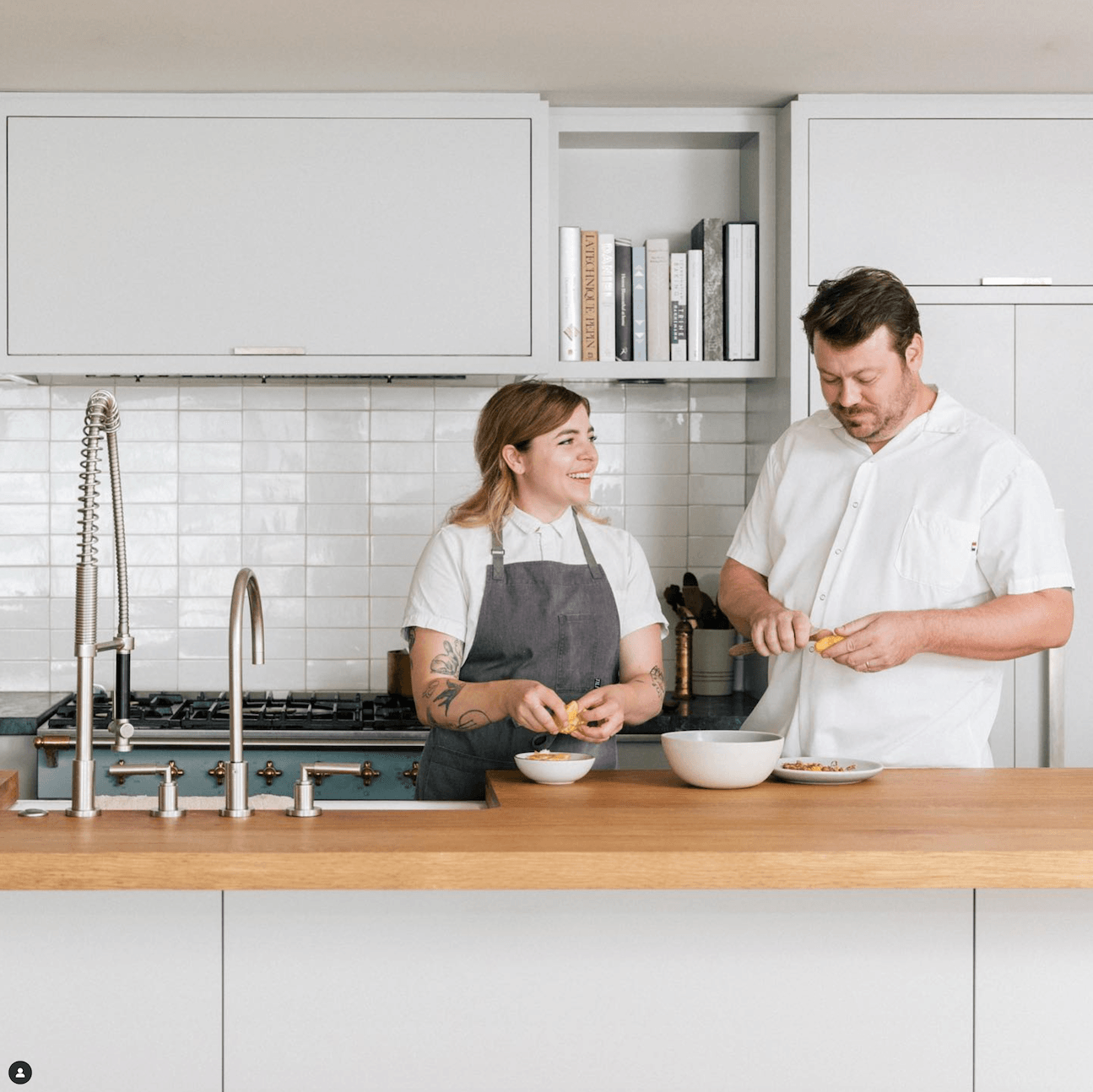 two chefs cooking together in the meal prep stage