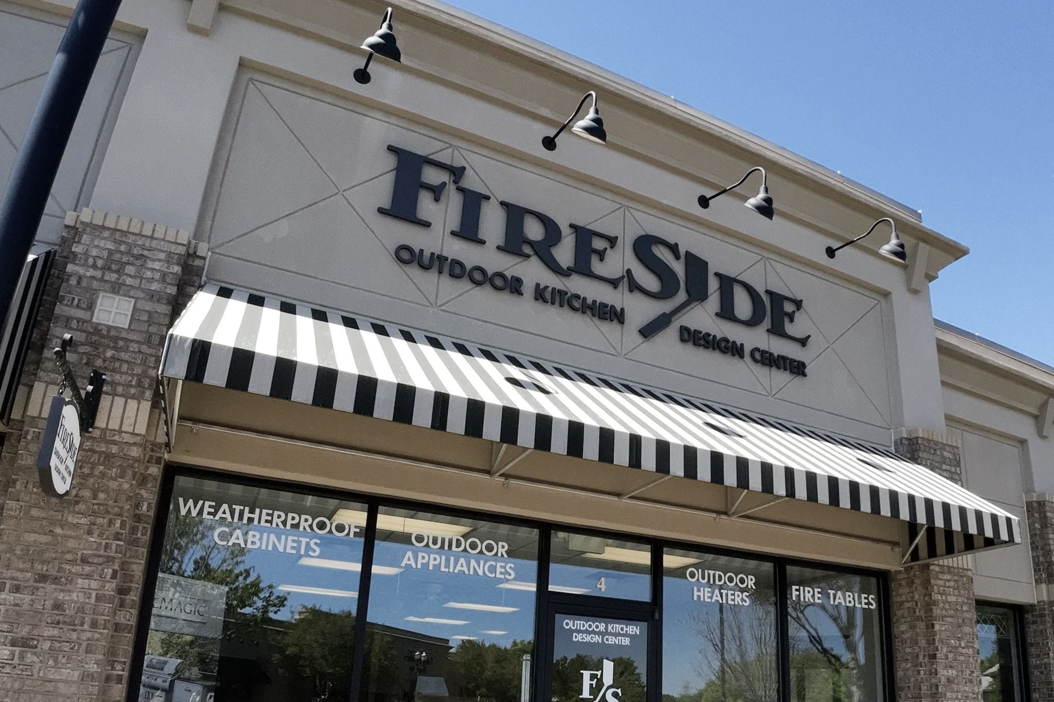 Fireside Kitchens storefront featuring a black and white awning.